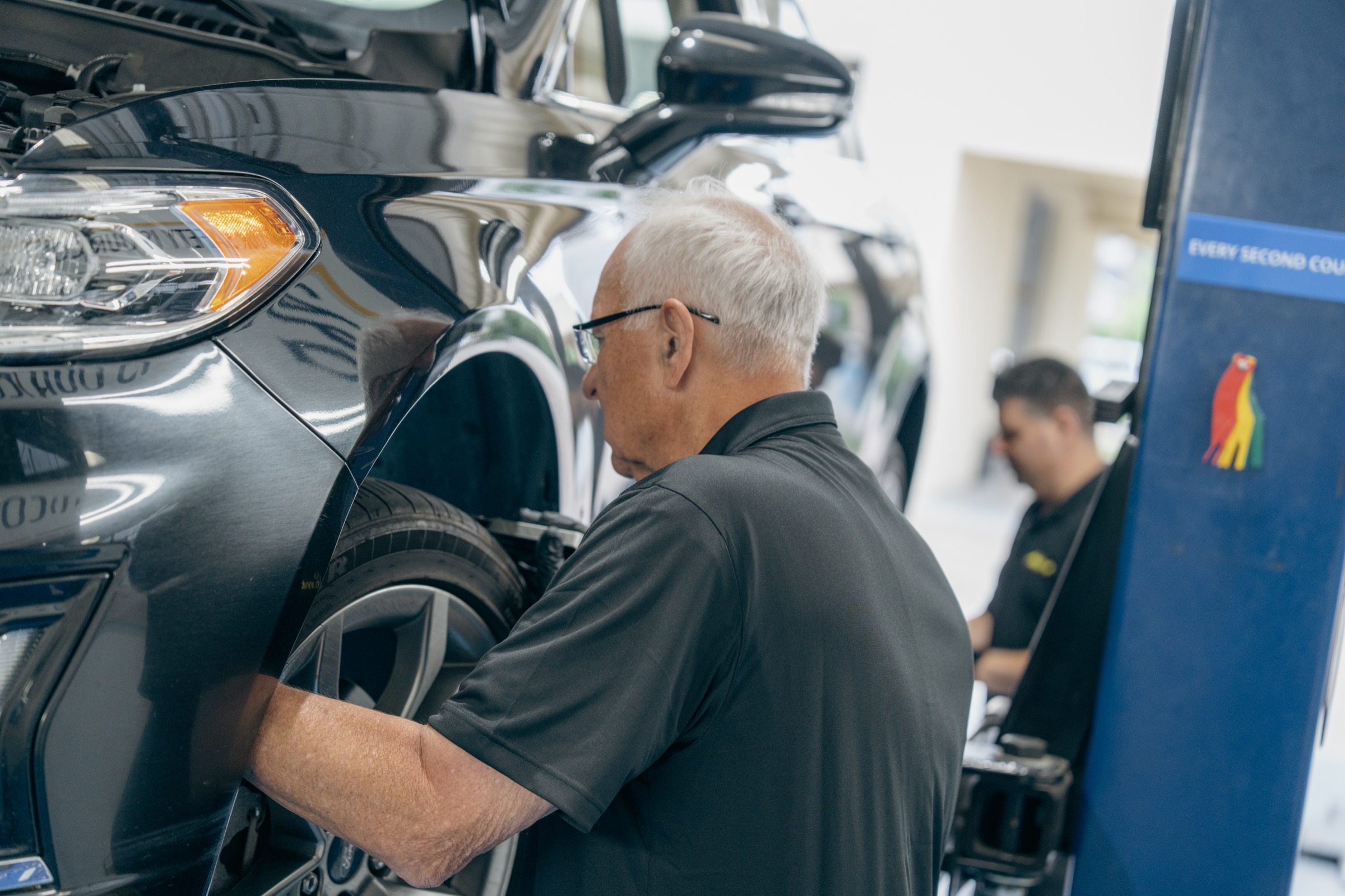 Adams Automotive technician inspection in the shop